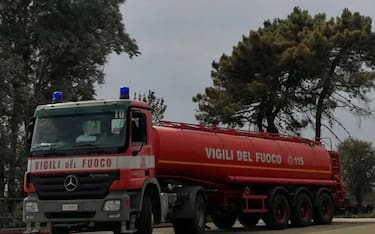 (210726) -- SARDINIA (ITALY), July 26, 2021 (Xinhua) -- Photo taken with a mobile phone on July 26, 2021 shows a fire truck near a fire site in Sardinia, Italy. Regional emergency services in Sardinia issued a new adverse weather warning for Monday, and the regional government has declared a state of emergency after large swaths of the major island were ravaged by wildfires in the last few days. (Italian Firefighters/Handout via Xinhua) - Italian Firefighters -//CHINENOUVELLE_CnyztpE007011_20210727_PEPFN0A001/2107270847/Credit:CHINE NOUVELLE/SIPA/2107270847