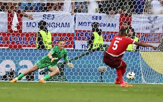 epa11463316 goalkeeper Jordan Pickford of England saves the penalty of Manuel Akanji of Switzerland during the penalty shootout at the UEFA EURO 2024 quarter-finals soccer match between England and Switzerland, in Dusseldorf, Germany, 06 July 2024.  EPA/ANNA SZILAGYI