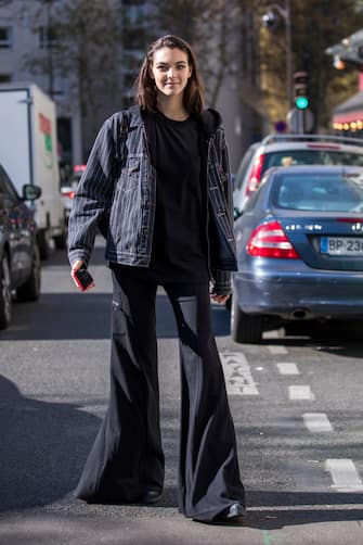 PARIS, FRANCE - SEPTEMBER 27:  Vittoria Ceretti, wearing a pinstripe jacket, a black hoody and black pants, is seen after the Chloe show on September 27, 2018 in Paris, France. (Photo by Claudio Lavenia/Getty Images)