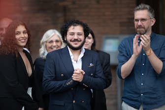 Patrick Zaki, the Egyptian activist, graduated from the University of Bologna, in Piazza Maggiore, at the party for his return, Bologna, 30 July 2023. "I thank the whole city, which allowed my liberation. This is a city of freedom and human rights. I am happy to be here in person, finally, after years of online calls," he said.    ANSA / MAX CAVALLARI