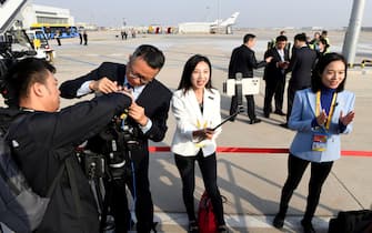 epa10922836 Reporters prepare for the arrival of Russia's President Vladimir Putin ahead of the Third Belt and Road Forum at Beijing Capital International Airport in Beijing, China, 17 October 2023.  EPA/Parker Song/POOL