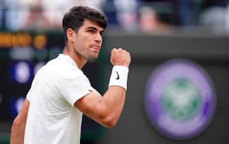 Carlos Alcaraz reacts during his match against Aleksandar Vukic (not pictured) on day three of the 2024 Wimbledon Championships at the All England Lawn Tennis and Croquet Club, London. Picture date: Wednesday July 3, 2024.