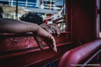 epa08527228 A handout photo made available by the press office of SOS Mediterranee, shows migrants boarded on Ocean Viking ship at the Mediterranean Sea, 04 July 2020. The ship is in international waters of Mediterranean Sea with 180 rescued migrants on board.  SOS Mediterranee for days asks to be able to disembark the migrants after declaring state of emergency due to the precarious conditions of the rescued people.  EPA/FLAVIO GASPERINI / SOS MEDITERRANEE / HANDOUT  HANDOUT EDITORIAL USE ONLY/NO SALES