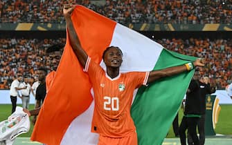 Ivory Coast's forward #20 Christian Kouame celebrates after Ivory Coast won the Africa Cup of Nations (CAN) 2024 final football match between Ivory Coast and Nigeria at Alassane Ouattara Olympic Stadium in Ebimpe, Abidjan on February 11, 2024. (Photo by Issouf SANOGO / AFP) (Photo by ISSOUF SANOGO/AFP via Getty Images)