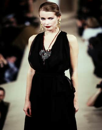 PARIS, FRANCE - JANUARY 16: Claudia Schiffer walks the runway during the Yves Saint Laurent Haute Couture Spring/Summer 1997 fashion show as part of Paris Haute Couture Fashion Week on January 16, 1997 in Paris, France. (Photo by Victor VIRGILE/Gamma-Rapho via Getty Images)