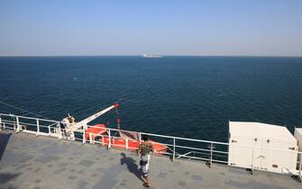 epa11012869 A Houthi fighter tours the deck of the Galaxy Leader cargo ship, seized by the Houthis offshore of the Al-Salif port on the Red Sea in the province of Hodeidah, Yemen, 05 December 2023. The Galaxy Leader ship, reportedly linked to an Israeli businessman, was seized and re-routed to offshore of the Yemeni port of Al-Salif by the Houthis on 19 November 2023 in retaliation for Israel's airstrikes on the Gaza Strip, according to statements by the Houthis. The ship, carrying around 25 crew members belonging to various nations, was seized as it was on its way to India. The Houthis, who control most of Yemen 's Red Sea coast, have fired missiles and drones at Israel and attacked more vessels transiting the area. Thousands of Israelis and Palestinians have died since the militant group Hamas launched an unprecedented attack on Israel from the Gaza Strip on 07 October, and the Israeli strikes on the Palestinian enclave which followed it.  EPA/YAHYA ARHAB