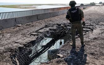 RUSSIA, KHERSON REGION - JUNE 23, 2023: An employee of the Russian Investigative Committee visits a bridge damaged by a Ukrainian strike near the village of Chongar. According to acting Kherson Region Governor Saldo, Ukraine has hit bridges between the region and Crimea, using what appears to be British cruise missiles Storm Shadow. Alexander Polegenko/TASS/Sipa USA