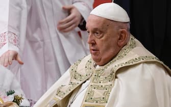 Pope Francis with statue of baby Jesus during the Christmas Night Mass at St Peter's Basilica in Vatican City, 24 December 2024. Today Pope Francis formally started the Catholic Jubilee Year 2025.  ANSA/FABIO FRUSTACI