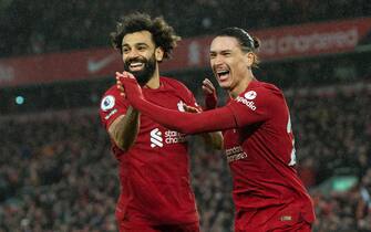 epa10505968 Liverpool's Darwin Nunez celebrates after scoring the fifth goal with Mohamed Salah (L) during the English Premier League soccer match between Liverpool FC and Manchester United in Liverpool, Britain, 05 March 2023 (issued 06 March 2023). Salah became Liverpool's all time goal scorer in the premier league.  EPA/Peter Powell EDITORIAL USE ONLY. No use with unauthorized audio, video, data, fixture lists, club/league logos or 'live' services. Online in-match use limited to 120 images, no video emulation. No use in betting, games or single club/league/player publications