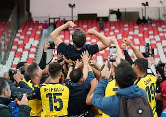 The Parma Calcio players are celebrating their mathematical promotion to Serie A at the end of the Serie B match on the SSC Bari field in Bari, Italy, on May 1, 2024. (Photo by Gabriele Maricchiolo/NurPhoto via Getty Images)