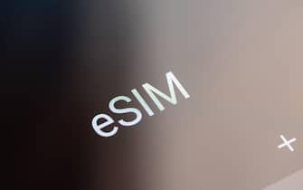 New york, USA - April 26, 2023: eSIM applications on smartphone screen close up view