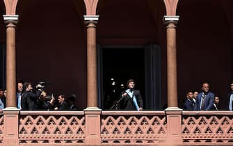 epa11022083 Argentina's President Javier Milei walks out onto the balcony of the Casa Rosada to greet supporters in Buenos Aires, Argentina, on 10 December 2023. Milei, arrived at the Casa Rosada (seat of government) for the first time as head of state of the South American country, after taking the oath of office in Congress and delivering his speech to citizens. The leader of La Libertad Avanza (ultra-right) moved with his sister and main advisor, Karina Milei, in a convertible vehicle to the Plaza de Mayo, where, upon arriving at the Metropolitan Cathedral, he got out of the car and walked among the shouting of his followers.  EPA/Juan Ignacio Roncoroni