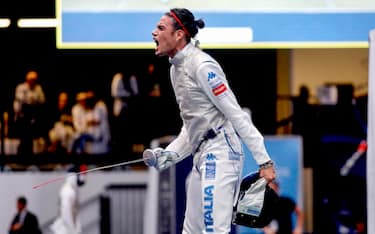 Tommaso Marini (L) exults in victory in men's individual foil round of 16 of the FIE World Fencing Championship in Milan, Italy, 27 July 2023.ANSA/MOURAD BALTI TOUATI

