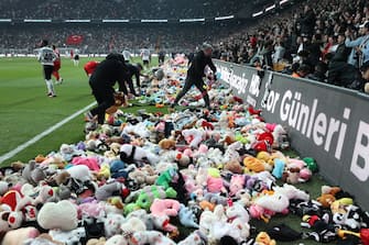 ISTANBUL, TURKIYE - FEBRUARY 26: Teddy bears and toys thrown on the field to be sent to the earthquake zone of the Vodafone Park Stadium prior to the Turkish Super Lig soccer match between Besiktas and Fraport TAV Antalyaspor, in Istanbul, Turkiye on February 26, 2023. On Feb.6 a strong 7.7 earthquake, centered in the Pazarcik district, jolted Kahramanmaras and strongly shook several provinces, including Gaziantep, Sanliurfa, Diyarbakir, Adana, Adiyaman, Malatya, Osmaniye, Hatay, and Kilis. On the same day at 1.24 p.m. (1024GMT), a 7.6 magnitude quake centered in Kahramanmaras' Elbistan district struck the region. (Photo by Ali Atmaca/Anadolu Agency via Getty Images)