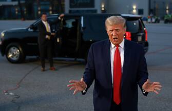 ATLANTA, GEORGIA - AUGUST 24: Former U.S. President Donald Trump speaks to the media at Atlanta Hartsfield-Jackson International Airport after surrendering at the Fulton County jail on August 24, 2023 in Atlanta, Georgia. Trump was booked on multiple charges related to an alleged plan to overturn the results of the 2020 presidential election in Georgia. (Photo by Joe Raedle/Getty Images)