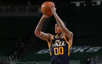 MILWAUKEE, WI - JANUARY 8: Jordan Clarkson #00 of the Utah Jazz shoots the ball against the Milwaukee Bucks on January 8, 2021 at the Fiserv Forum Center in Milwaukee, Wisconsin. NOTE TO USER: User expressly acknowledges and agrees that, by downloading and or using this Photograph, user is consenting to the terms and conditions of the Getty Images License Agreement. Mandatory Copyright Notice: Copyright 2021 NBAE (Photo by Gary Dineen/NBAE via Getty Images).
