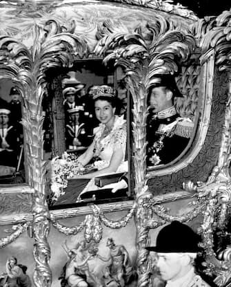 Embargoed to 2230 Sunday April 9 File photo dated 2/6/1953 of Queen Elizabeth II, accompanied by the Duke Of Edinburgh, in the Gold State Coach as it neared Trafalgar Square on the route to Westminster for her Coronation. The King and Queen Consort will travel to the coronation in the modern Diamond Jubilee State Coach and return in the historic Gold State Coach. Issue date: Sunday April 9, 2023.