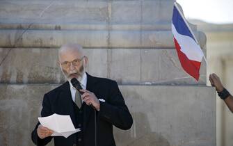 epa05576612 French writer Renaud Camus, who in 2014 was convicted of incitement to racial hatred, delivers a speech to demonstrators from the far right group 'La Ligue du midi' (lit.: The League of the South) during a demonstration in Montpellier, Southern France, 08 October 2016. Their protest is aimed against the French government policy for migrants and refugees.  EPA/GUILLAUME HORCAJUELO