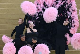 TOPSHOT - US' singer Lady Gaga sings a song at the Sully bridge area before the opening ceremony of the Paris 2024 Olympic Games in Paris on July 26, 2024. (Photo by Aris MESSINIS / AFP) (Photo by ARIS MESSINIS/AFP via Getty Images)