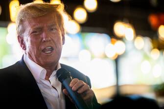 DES MOINES, IOWA - AUGUST 12: Republican presidential candidate and former U.S. President Donald Trump speaks during a rally at the Steer N' Stein bar at the Iowa State Fair on August 12, 2023 in Des Moines, Iowa. Republican and Democratic presidential hopefuls, including Florida Gov. Ron DeSantis, former President Donald Trump are visiting the fair, a tradition in one of the first states to hold caucuses in 2024.  (Photo by Brandon Bell/Getty Images)