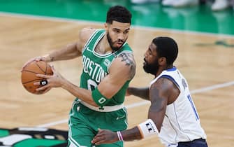 BOSTON, MASSACHUSETTS - JUNE 17: Jayson Tatum #0 of the Boston Celtics drives past Kyrie Irving #11 of the Dallas Mavericks during the first quarter of Game Five of the 2024 NBA Finals at TD Garden on June 17, 2024 in Boston, Massachusetts. NOTE TO USER: User expressly acknowledges and agrees that, by downloading and or using this photograph, User is consenting to the terms and conditions of the Getty Images License Agreement. (Photo by Adam Glanzman/Getty Images)
