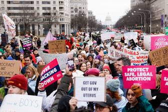 WASHINGTON, DC - JANUARY 22: People march to the White House during the annual National Women's March on January 22, 2023 in Washington, DC. The march, also called "Bigger than Roe," was held to mark the 50-year anniversary since the ruling on Roe v. Wade, and to protest the Supreme Courtâ  s ruling in the Dobbs vs Jackson Women's Health case, which takes back federal protections for access abortions. (Photo by Anna Moneymaker/Getty Images)