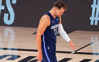 LAKE BUENA VISTA, FLORIDA - AUGUST 23: Luka Doncic #77 of the Dallas Mavericks walks up court against the LA Clippers during the first quarter in Game Four of the Western Conference First Round during the 2020 NBA Playoffs at AdventHealth Arena at ESPN Wide World Of Sports Complex on August 23, 2020 in Lake Buena Vista, Florida. NOTE TO USER: User expressly acknowledges and agrees that, by downloading and or using this photograph, User is consenting to the terms and conditions of the Getty Images License Agreement.  (Photo by Kevin C. Cox/Getty Images)