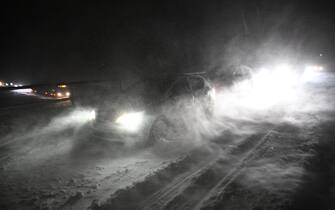 epa11055846 Motorists struggle through a snowy road as  hundreds of vehicles are stuck on the European route E22 at Ekerod near Horby in southern Sweden, 03 January 2024. Strong winds and drifting snow have caused several traffic accidents in the area. Emergency services and the defence force are deploying tracked vehicles to evacuate people stuck in their cars for hours.  EPA/Johan Nilsson  SWEDEN OUT