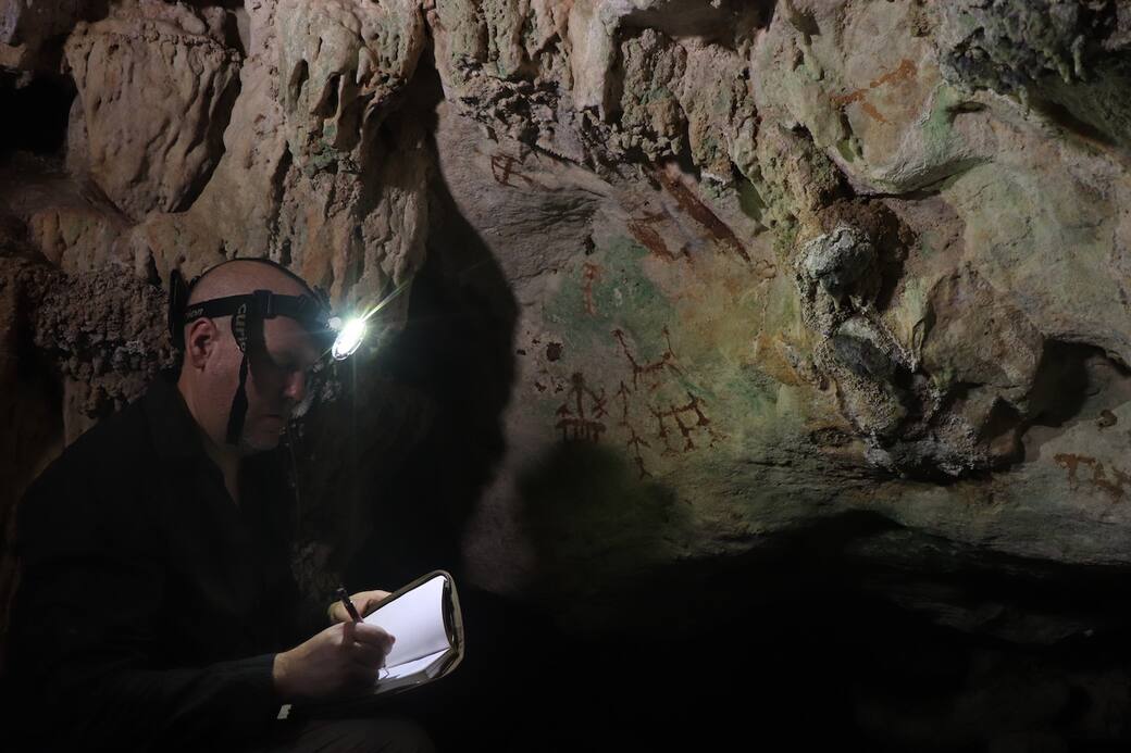 Professor Maxime Aubert working in the cave