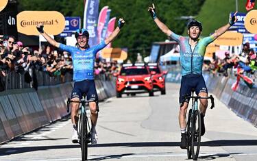 Italian rider Lorenzo Fortunato of  XDS Astana Team wearing the best climber's blue jersey and italian rider Christian Scaroni   of Xds Astana Team celebrate after crossing the finish line and win the 16th stage of the 108 Giro d'Italia 2025, cycling race over 203 km from Piazzola sul Brenta to San Valentino, 27 May 2025. ANSA/LUCA ZENNARO

