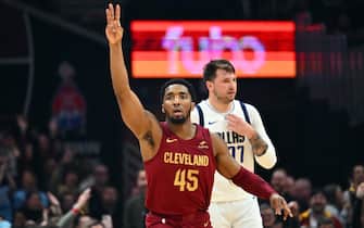 CLEVELAND, OHIO - FEBRUARY 27: Donovan Mitchell #45 of the Cleveland Cavaliers celebrates after scoring over Luka Doncic #77 of the Dallas Mavericks during the second quarter at Rocket Mortgage Fieldhouse on February 27, 2024 in Cleveland, Ohio. NOTE TO USER: User expressly acknowledges and agrees that, by downloading and or using this photograph, User is consenting to the terms and conditions of the Getty Images License Agreement. (Photo by Jason Miller/Getty Images)