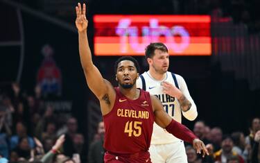 CLEVELAND, OHIO - FEBRUARY 27: Donovan Mitchell #45 of the Cleveland Cavaliers celebrates after scoring over Luka Doncic #77 of the Dallas Mavericks during the second quarter at Rocket Mortgage Fieldhouse on February 27, 2024 in Cleveland, Ohio. NOTE TO USER: User expressly acknowledges and agrees that, by downloading and or using this photograph, User is consenting to the terms and conditions of the Getty Images License Agreement. (Photo by Jason Miller/Getty Images)