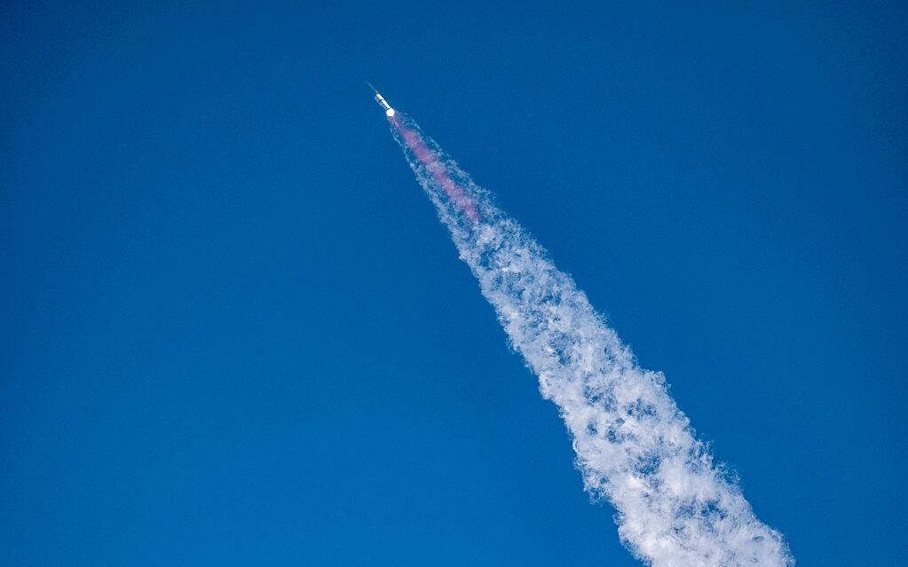 The SpaceX Starship rocket launches from Starbase, Texas, as seen from South Padre Island on May 27, 2025. SpaceX mission control lost contact with the upper stage of Starship as it leaked fuel, spun out of control, and made an uncontrolled reentry after flying halfway around the world, likely disintegrating over the Indian Ocean, officials said. (Photo by Sergio FLORES / AFP) (Photo by SERGIO FLORES/AFP via Getty Images)          
