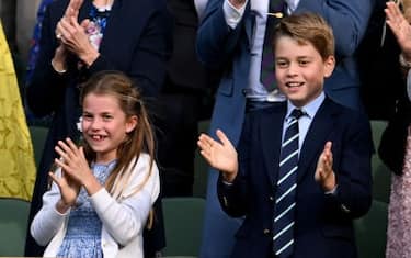 LONDON, ENGLAND - JULY 16: Catherine, Princess of Wales, Princess Charlotte of Wales, Prince George of Wales and Prince William, Prince of Wales, are seen in the Royal Box applauding the winner Carlos Alcaraz of Spain after his victory over Novak Djokovic of Serbia in the men's final during day fourteen of The Championships Wimbledon 2023 at All England Lawn Tennis and Croquet Club on July 16, 2023 in London, England. (Photo by Stringer/Anadolu Agency via Getty Images)