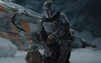 The Mandalorian The Mandalorian (Pedro Pascal) and the Child in THE MANDALORIAN, season two. © 2020 Lucasfilm Ltd. & TM. All Rights Reserved.