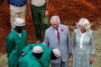 epa10952852 Britain's King Charles (C) and Queen Camilla (R) learn about an orphaned rhino during a visit to the Sheldrick elephant orphanage, on the outskirts of Nairobi, Kenya, 01 November 2023. Britain's King Charles III and his wife Queen Camilla are on a four-day state visit starting on 31 October 2023, to Nairobi and Mombasa. This will be the first official visit by Their Majesties to an African nation and the first to a commonwealth member state since their coronation in May 2023.  EPA/THOMAS MUKOYA / POOL