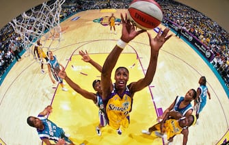 LOS ANGELES - SEPTEMBER 1: Lisa Leslie #9 of the Los Angeles Sparks rebounds during Game Two of the 2001 WNBA Finals on September 1, 2001 at the Staples Center in Los Angeles, California. NOTE TO USER: User expressly acknowledges and agrees that, by downloading and or using this photograph, User is consenting to the terms and conditions of the Getty Images License Agreement. Mandatory Copyright Notice: Copyright 2001 NBAE (Photo by Andrew D. Bernstein/NBAE via Getty Images)