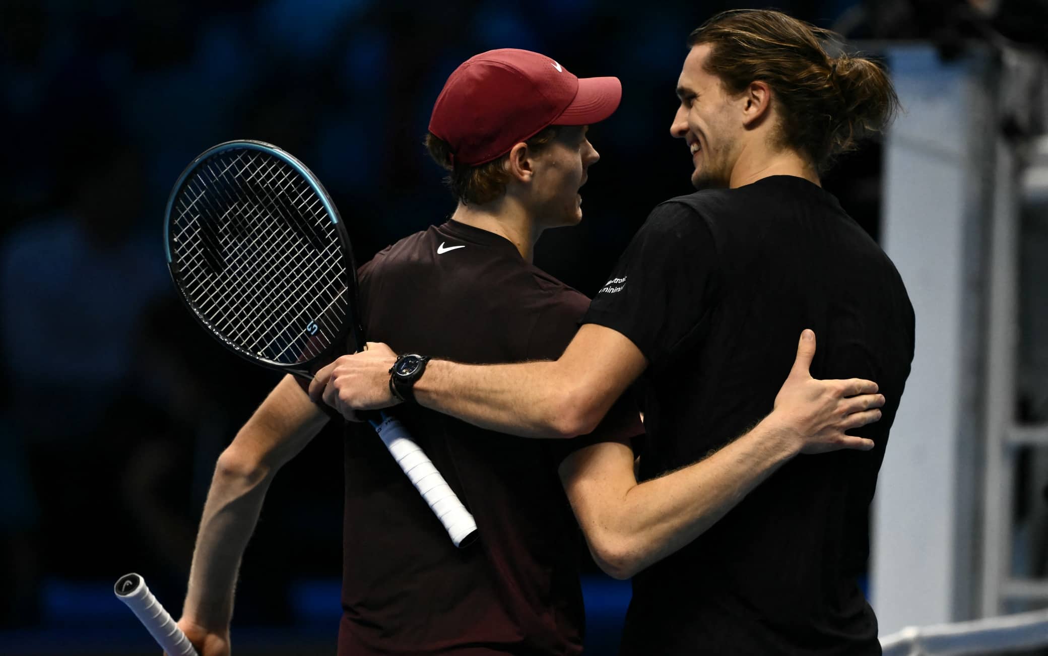 Italy's Jannik Sinner is congratulated by Germany's Alexander Zverev after winning at the ATP Finals tennis tournament in Turin on November 12, 2025. (Photo by Marco BERTORELLO / AFP)