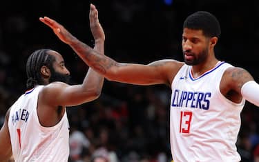 ATLANTA, GEORGIA - FEBRUARY 05:  James Harden #1 of the LA Clippers reacts with Paul George #13 after drawing a foul on a three-pointer against the Atlanta Hawks during the fourth quarter at State Farm Arena on February 05, 2024 in Atlanta, Georgia.  NOTE TO USER: User expressly acknowledges and agrees that, by downloading and/or using this photograph, user is consenting to the terms and conditions of the Getty Images License Agreement.  (Photo by Kevin C. Cox/Getty Images)