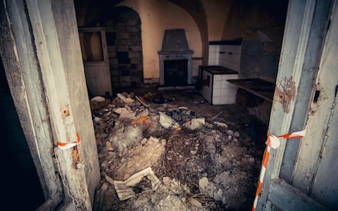 A view of the ghost town of Apice, in the province of Benevento, southern Italy, 22 November 2016. After the Irpinia earthquake that took place in southern Italy on 23 November 1980, leaving at least 2,500 people dead, 8,000 injured and 250,000 homeless, the town in the heart of the Sannio area was evacuated and its residents moved into what has become the new Apice. Only recently the narrow streets and the tragically abandoned buildings have started, slowly, to repopulate. ANSA/ CESARE ABBATE
