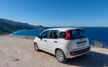 Lefkada island. 10.15.2022. A Fiat Panda by a seaside location with a beautiful view of the sea and long sandy beach.