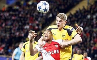 epa05916021 Monaco's Kylian Mbappe (front) in action against Dortmund's Matthias Ginter (R) during the UEFA Champions League quarter final, second leg soccer match between AS Monaco and Borussia Dortmund at Stade Louis II in Monaco, 19 April 2017.  EPA/GUILLAUME HORCAJUELO