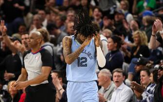 MINNEAPOLIS, MN - APRIL 23: Ja Morant #12 of the Memphis Grizzlies reacts after fouling Patrick Beverley #22 of the Minnesota Timberwolves in the third quarter of the game during Game Four of the Western Conference First Round at Target Center on April 23, 2022 in Minneapolis, Minnesota. The Timberwolves defeated the Grizzlies 119-118 to tie the series 2-2. NOTE TO USER: User expressly acknowledges and agrees that, by downloading and or using this Photograph, user is consenting to the terms and conditions of the Getty Images License Agreement. (Photo by David Berding/Getty Images)