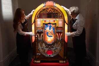 A general view of A multicoloured, illuminated 1941 Wurlitzer jukebox, which was acquired by Mercury for his kitchen at Garden Lodge, a
room where he spent so much of his time. (est. £15,000 - £25,000) as part of a photocall for Sotheby's 'Freddie Mercury A World Of His Own' Exhibition which runs for four weeks and contains more than 1,400 lots from his London home - Sotheby's in London, England, UK on Thursday 3 August, 2023.
 
*** lyrics are copyright: Queen Music Ltd/Sony Music Publishing UK Ltd ***, Credit:Justin Ng / Avalon