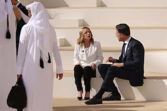 DUBAI, UNITED ARAB EMIRATES - DECEMBER 01: Italian Prime Minister Giorgia Meloni speaks with Dutch Prime Minister Mark Rutte following a family photo of heads of state during day one of the high-level segment of the UNFCCC COP28 Climate Conference at Expo City Dubai on December 01, 2023 in Dubai, United Arab Emirates. The COP28, which is running from November 30 through December 12, brings together stakeholders, including international heads of state and other leaders, scientists, environmentalists, indigenous peoples representatives, activists and others to discuss and agree on the implementation of global measures towards mitigating the effects of climate change. 
 (Photo by Sean Gallup/Getty Images)