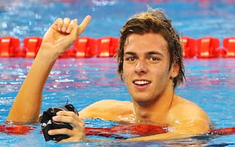 Gregorio Paltrinieri of Italy reacts after winning the men's 1500m freestyle during the 12th Fina World Swimming Championships (25m) on December 7, 2014 in the Qatari capital Doha. AFP PHOTO/MARWAN NAAMANI        (Photo credit should read MARWAN NAAMANI/AFP via Getty Images)