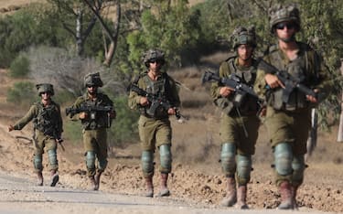 epaselect epa11408270 Israeli soldiers patrol along the border with the Gaza Strip, at an undisclosed location in southern Israel, 13 June 2024. The Israeli military stated on 13 June that its troops are continuing to operate against 'terrorist infrastructure and operatives' in the Gaza Strip. More than 37,000 Palestinians and over 1,400 Israelis have been killed, according to the Palestinian Health Ministry and the Israel Defense Forces (IDF), since Hamas militants launched an attack against Israel from the Gaza Strip on 07 October 2023, and the Israeli operations in Gaza and the West Bank which followed it.  EPA/ABIR SULTAN