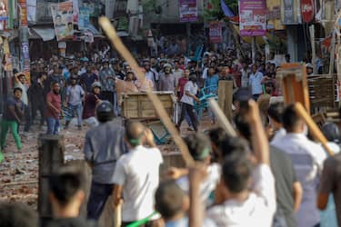 UNIVERSITY OF DHAKA, DHAKA, BANGLADESH - 2024/07/16: Clash between Anti-quota protesters and Bangladesh Chhatra League, the student wing of the ruling party Bangladesh Awami League in Dhaka. At Least five demonstrators were Killed in Bangladesh on July 16 during violent clashes between rival student groups over quotas for coveted government jobs, police said, a day after more than 400 others were injured. (Photo by K M Asad/LightRocket via Getty Images)