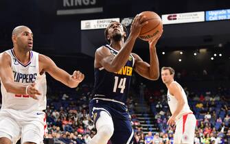 ONTARIO, CA - OCTOBER 12: Ish Smith #14 of the Denver Nuggets shoots the ball against the LA Clippers during a preseason game on October 12, 2022 at Toyota Arena in Ontario, California. NOTE TO USER: User expressly acknowledges and agrees that, by downloading and/or using this Photograph, user is consenting to the terms and conditions of the Getty Images License Agreement. Mandatory Copyright Notice: Copyright 2022 NBAE (Photo by Adam Pantozzi/NBAE via Getty Images) 
