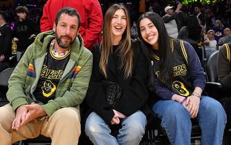 LOS ANGELES, CALIFORNIA - FEBRUARY 08: (L-R) Adam Sandler, Jackie Sandler and Sadie Sandler attend a basketball game between the Los Angeles Lakers and the Denver Nuggets at Crypto.com Arena on February 08, 2024 in Los Angeles, California. NOTE TO USER: User expressly acknowledges and agrees that, by downloading and or using this photograph, User is consenting to the terms and conditions of the Getty Images License Agreement. (Photo by Allen Berezovsky/Getty Images)